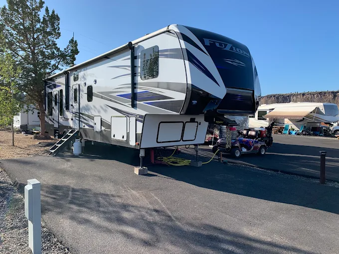 Copper Ridge RV Resort entrance with American flag and canyon backdrop